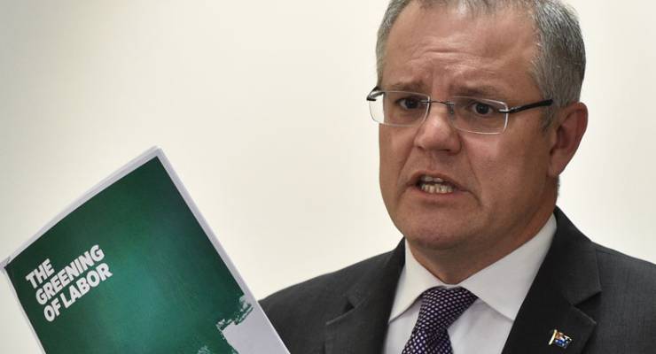 Scott Morrison holds up a pamphlet called The Greening of Labor