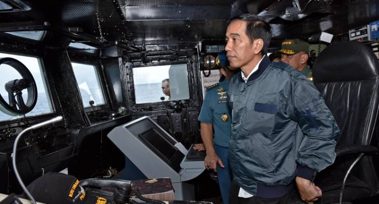 Indonesian President Joko Widodo visits a navy ship in the Indonesian corner of the South China Sea