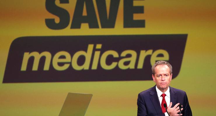 Bill Shorten in front of Save Medicare banner