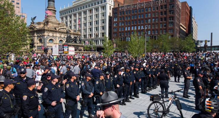 Police stand watch over a protest in downtown Cleveland, Ohio