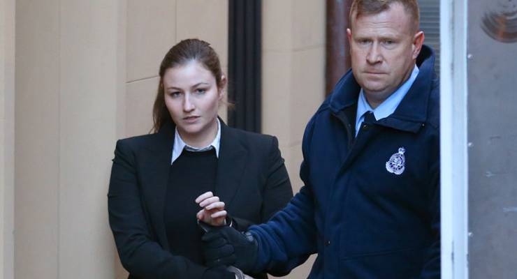 Harriet Wran is escorted from the Supreme Court