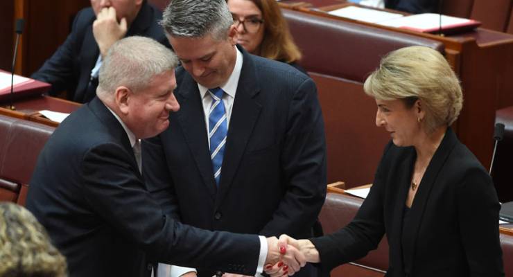 Senators Mitch Fifield, Mathias Cormann and Michaelia Cash celebrate the passing of the ABCC bill