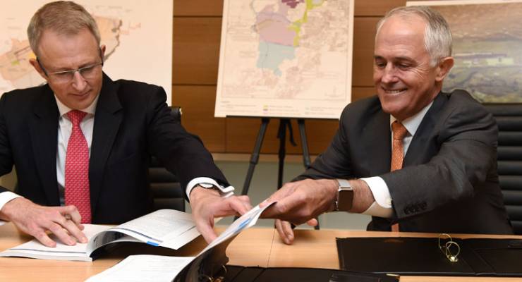 rime Minister Malcolm Turnbull (right), and Federal Urban Infrastructure Minister Paul Fletcher sign copies of the airport plan