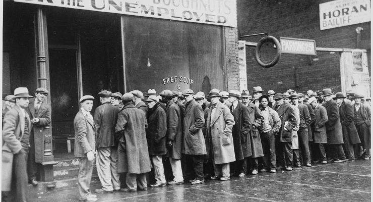 Men queue outside a Depression-era soup kitchen in Chicago.