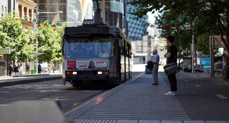 two-men-waiting-for-tram-in-melbourne