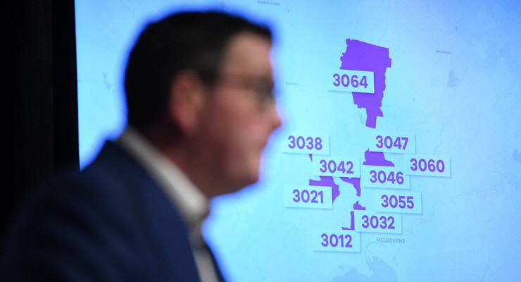 daniel andrews in front of TV screen showing melbourne postcodes