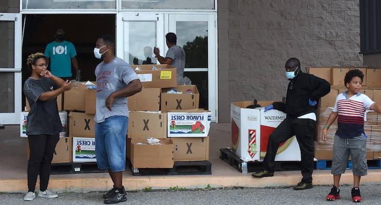 Volunteers distribute food to the unemployed in Orlando, Florida
