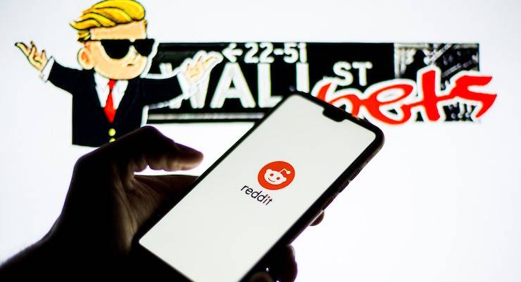 A Reddit logo on a smartphone with the WallStreetBets logo.