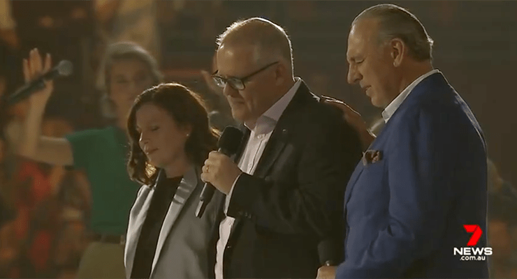 Scott Morrison with his wife, Jenny, and Hillsong founder Brian Houston at the Hillsong Conference at Sydney Olympic Park in 2019 (Image: Seven News)