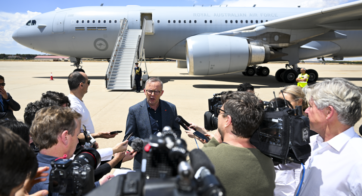 Anthony Albanese speaks to the media after arriving in Madrid (Image: AAP/Lukas Coch)