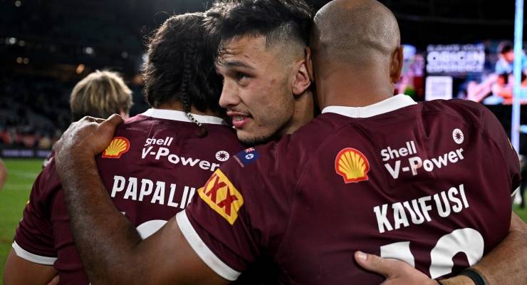 Tino Fa'asuamaleaui of the Maroons (centre) celebrates with Josh Papalii (left) and Felise Kaufusi following their win in Game 1 of the 2022 State of Origin series between the New South Wales Blues and the Queensland Maroons at Accor Stadium in Sydney, Wednesday, June 8, 2022. (AAP Image/Dan Himbrechts)