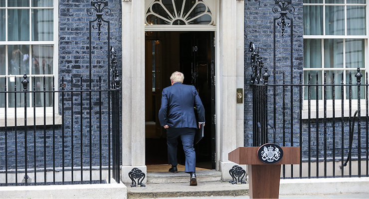 Boris Johnson returns back inside No 10 Downing Street after resigning (Image: AAP/Steve Taylor)