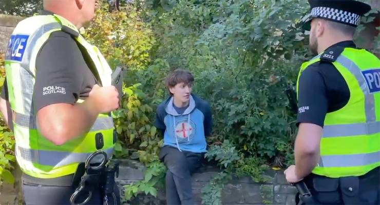 Rory, protester arrested for shouting at Prince Andrew (Image: Twitter/@janderson_news)