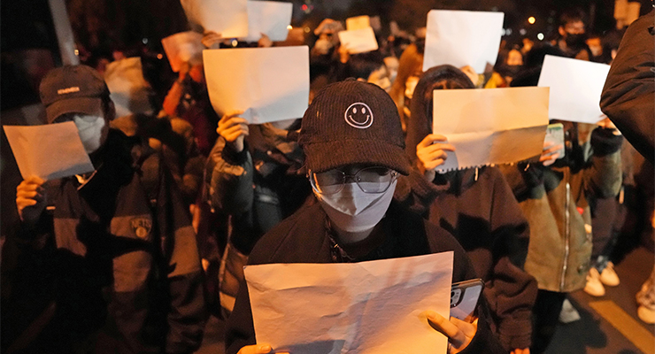 Protesters hold up blank papers and chant slogans as they march in recent protests in Beijing, China (Image: AAP/AP/Ng Han Guan)