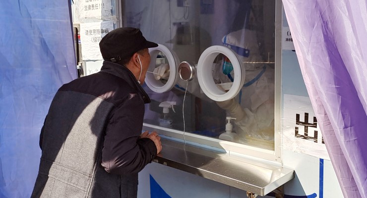 A man takes a COVID test in Shanghai