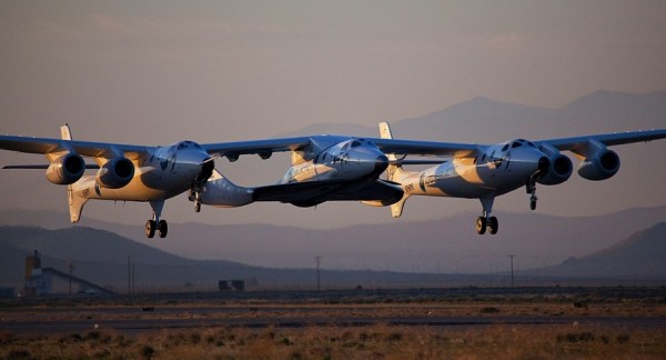 Virgin Galactic VSS Enterprise (centre) in a non-launch test attached to its lifter, photo by Mark Greenberg