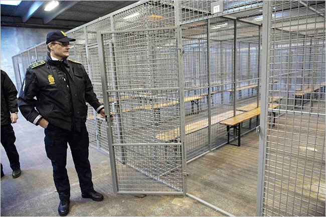 Danish police demonstrate the special COP15 "climate cages" (Jens Noergaard Larsen/Scanpix, via Reuters)