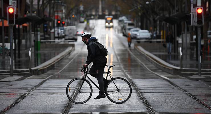 A cyclist on Bourke Street in Melbourne (Image: AAP/James Ross)