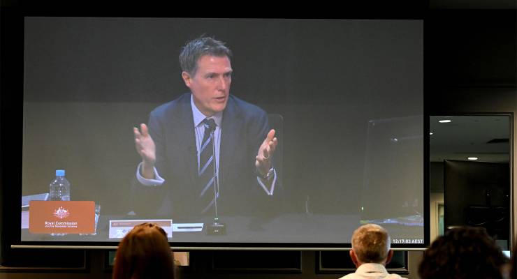 Former Liberal minister Christian Porter is seen on a screen at the royal commission into the robodebt scheme (Image: AAP/Darren England)