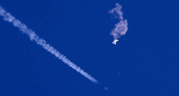 The downing of a suspected Chinese spy balloon by a US F-22 fighter jet (Image: AAP/AP/Chad Fish)