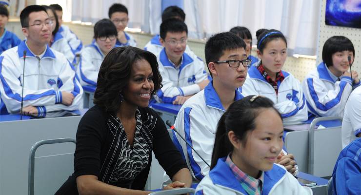 Former US first lady Michelle Obama with Chinese students in Chengdu city, China, 2014 (Image: AAP/Stringer)