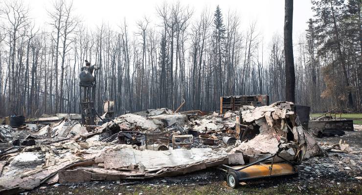 A structure destroyed by wildfires in Drayton Valley southwest of Edmonton, Canada (Image: Jason Franson/The Canadian Press via AP)