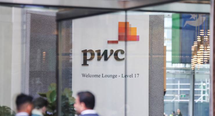 PwC sign is seen in the lobby of its offices in Barangaroo, NSW (Image: AAP/Reuters/Lewis Jackson)