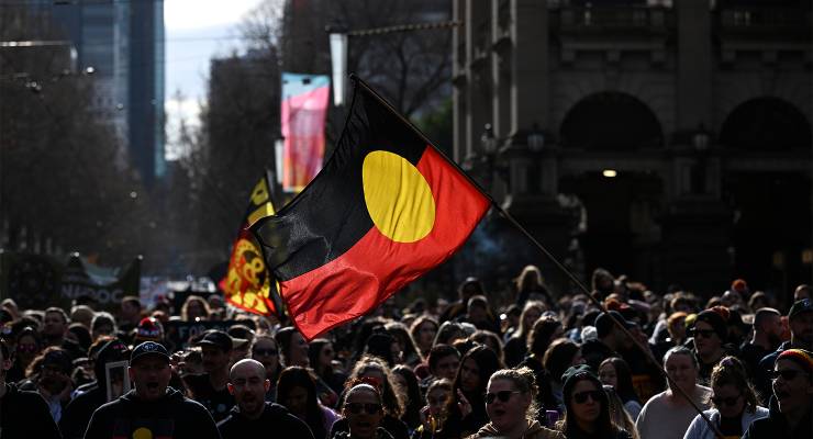 The Indigenous flag flies during the annual Victorian NAIDOC march in Melbourne