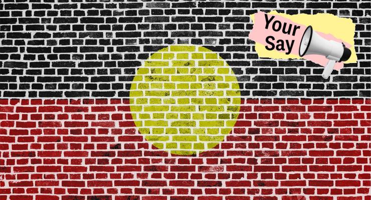 A brick wall painted with the Aboriginal flag (Image: Adobe/Private Media)