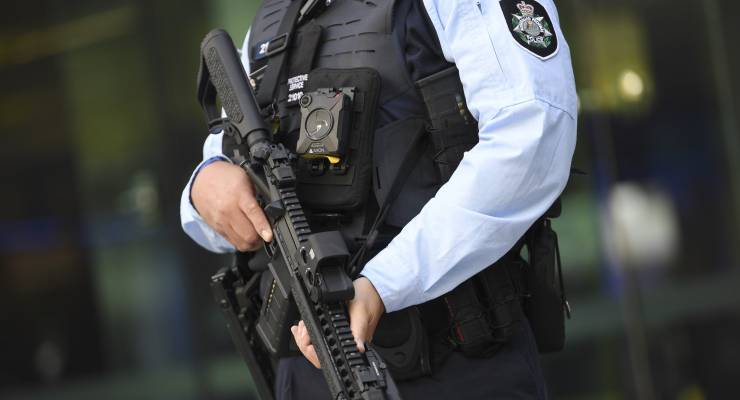 AFP officer (Image: AAP/Lukas Coch)
