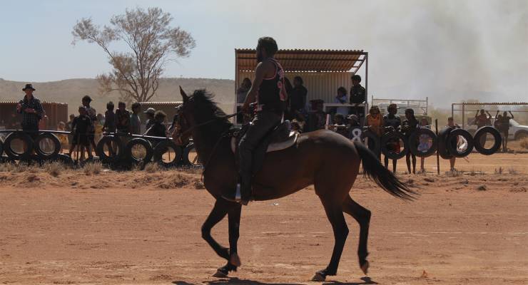 A rider at the Ltyentye Apurte race course (Image: Julia Bergin/Private Media)