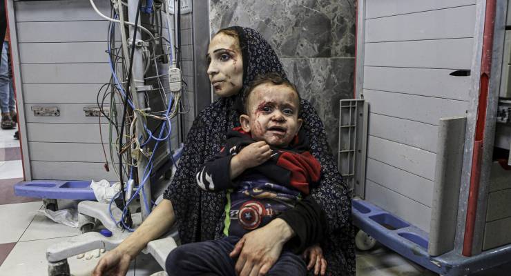 A woman and child wait for treatment at a Gaza hospital (Image: AP/Abed Khaled)