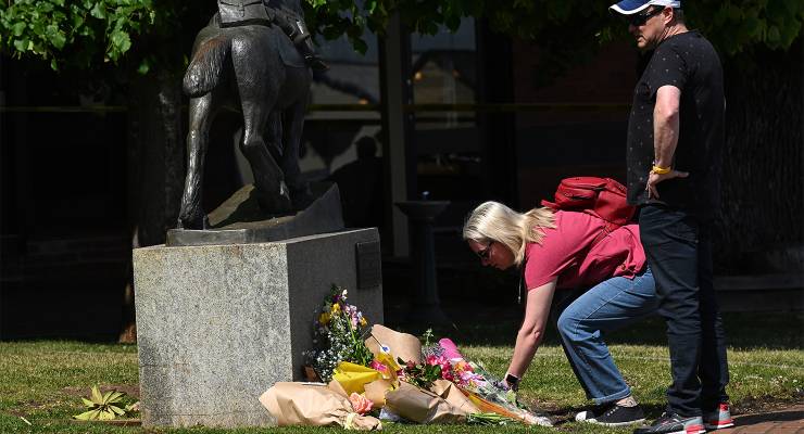 Mourners in Daylesford at site of a car crash that killed five people, including two children (Image: AAP/James Ross)