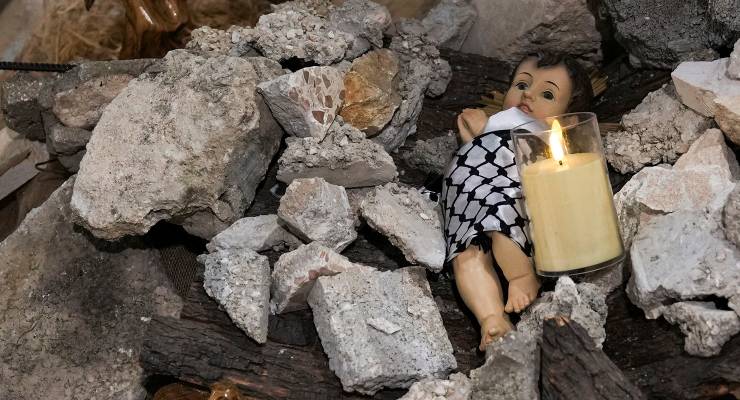 A nativity installation with a doll symbolising baby Jesus, inside the Evangelical Lutheran Church in the West Bank town of Bethlehem (Image: AAP/AP/Mahmoud Illean)