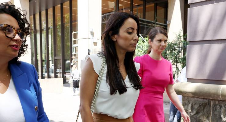 Antoinette Lattouf (centre) leaving the FWC hearing (Image: AAP/Toby Zerna)