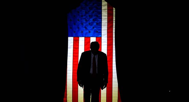 Former president Donald Trump steps on stage at a campaign event (Image: AAP/Matt Rourke)
