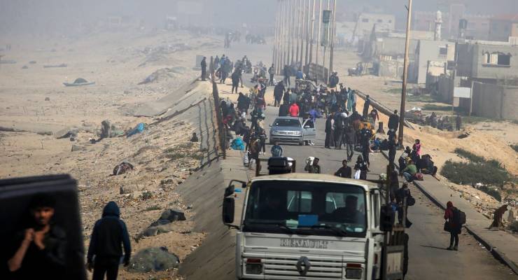 Displaced civilians walking south along the Gaza Strip (Image: EPA/Mohammed Saber)