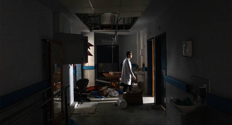A Palestinian doctor inspects the damaged Nasser Hospital in Khan Younis, April 8, 2024 (Image: AAP/Haitham Imad)